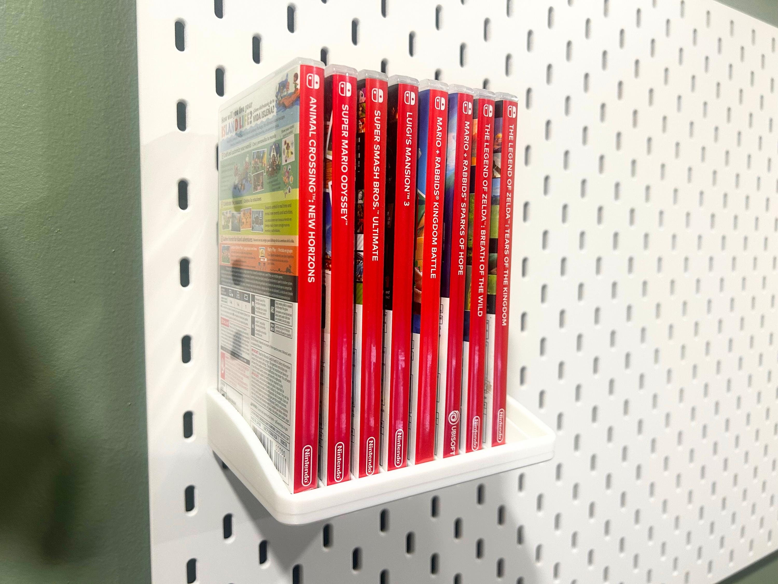 Ikea Skadis Nintendo Switch game display organizer holding 7 games.