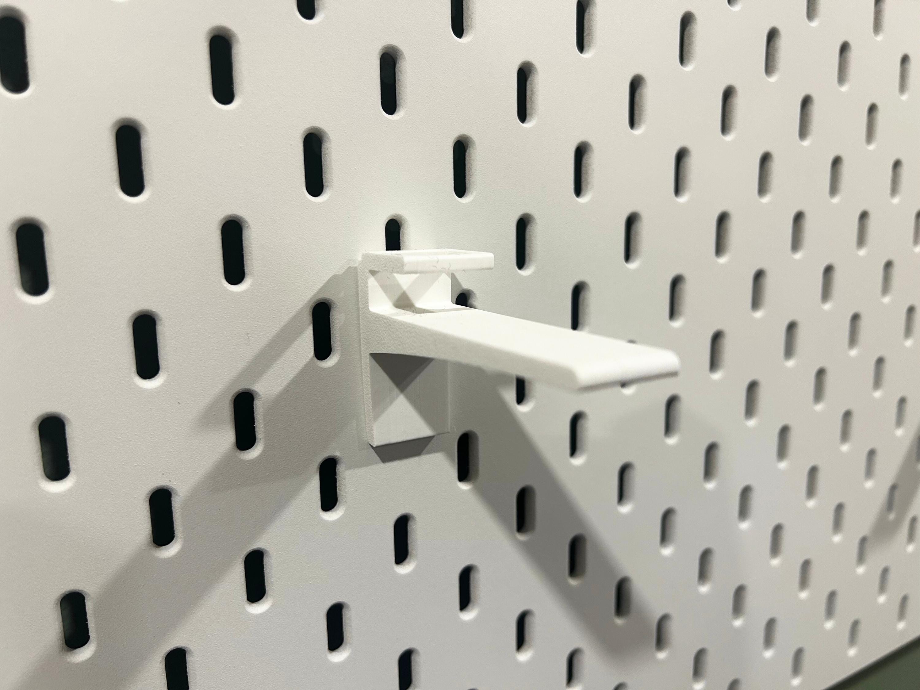 White Ikea Skadis hat display mount.